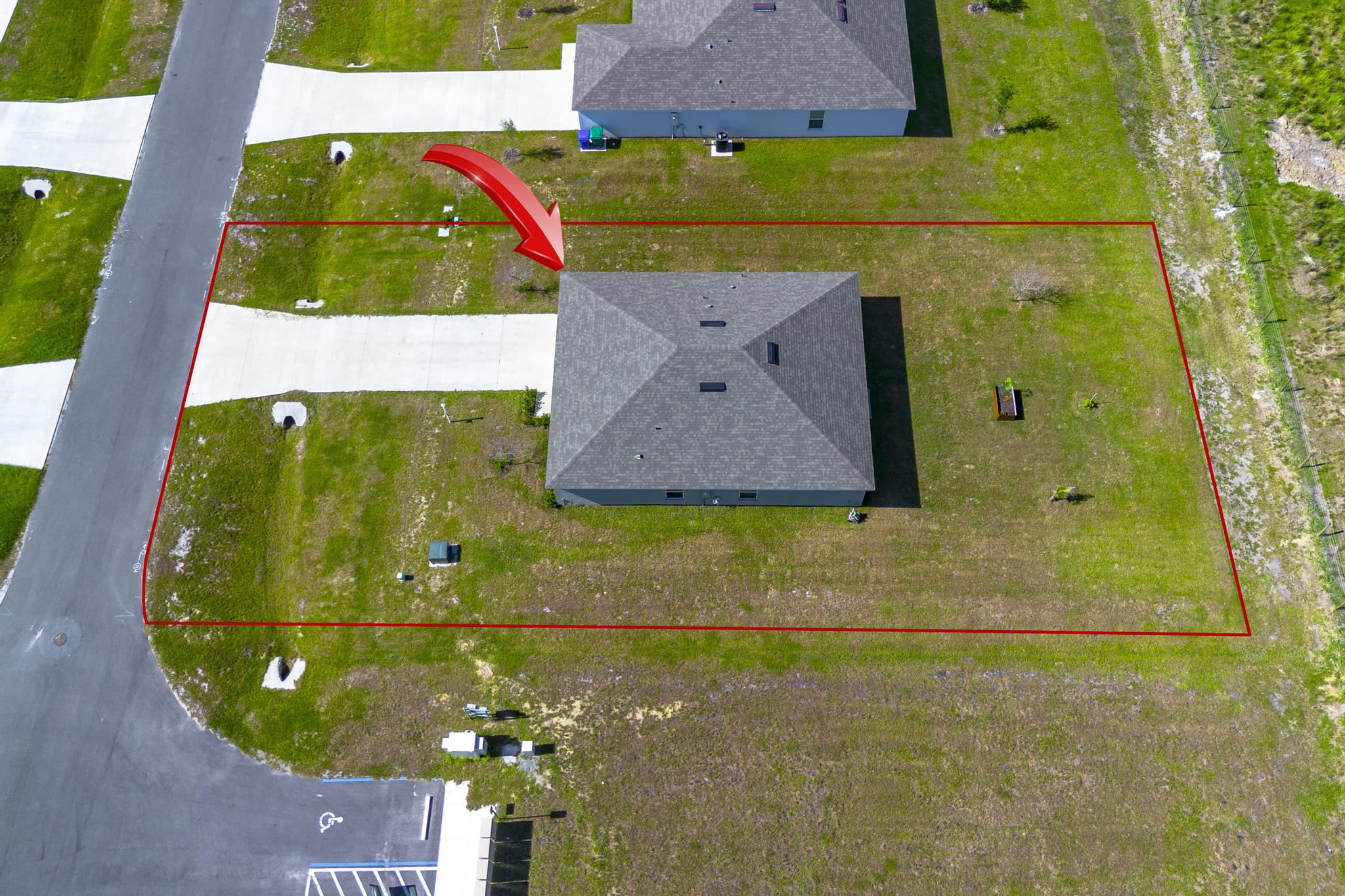 Aerial with the property's lot highlighted