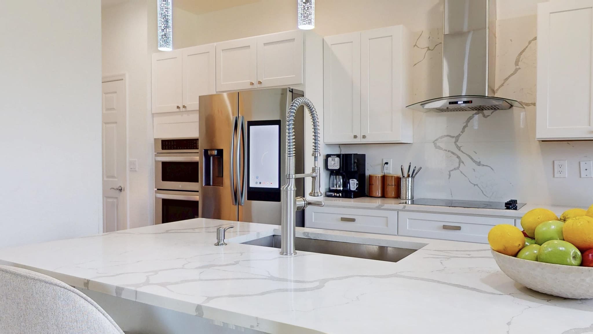 Modern white kitchen with quartz counters