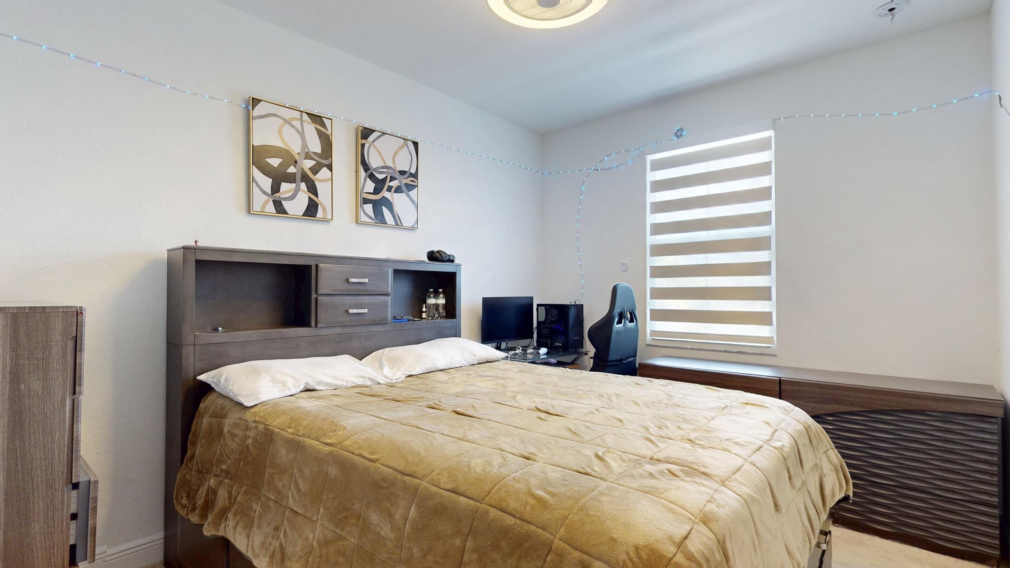 Primary bedroom with banded blinds