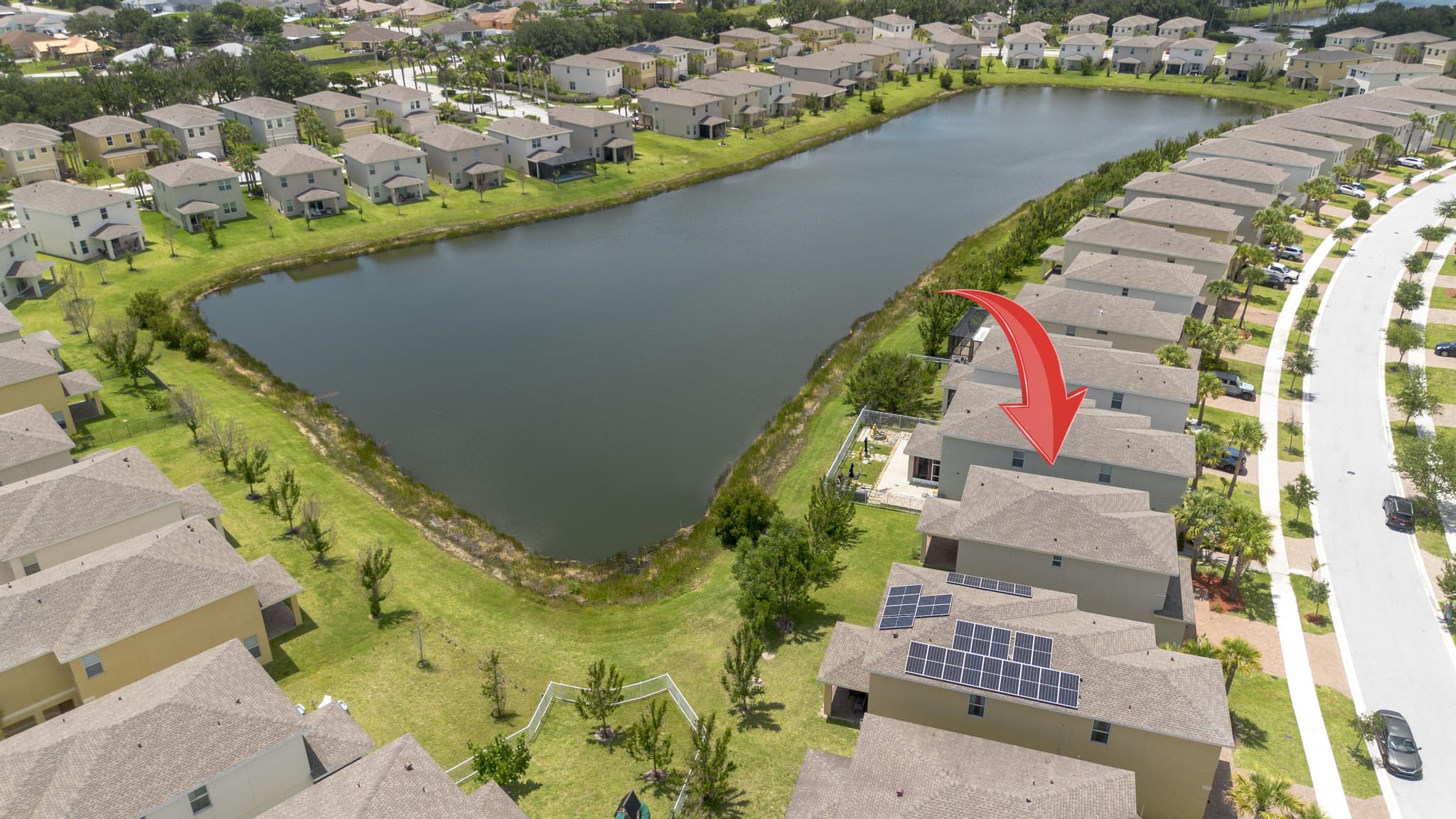 Aerial with the home's lakefront lot highlighted