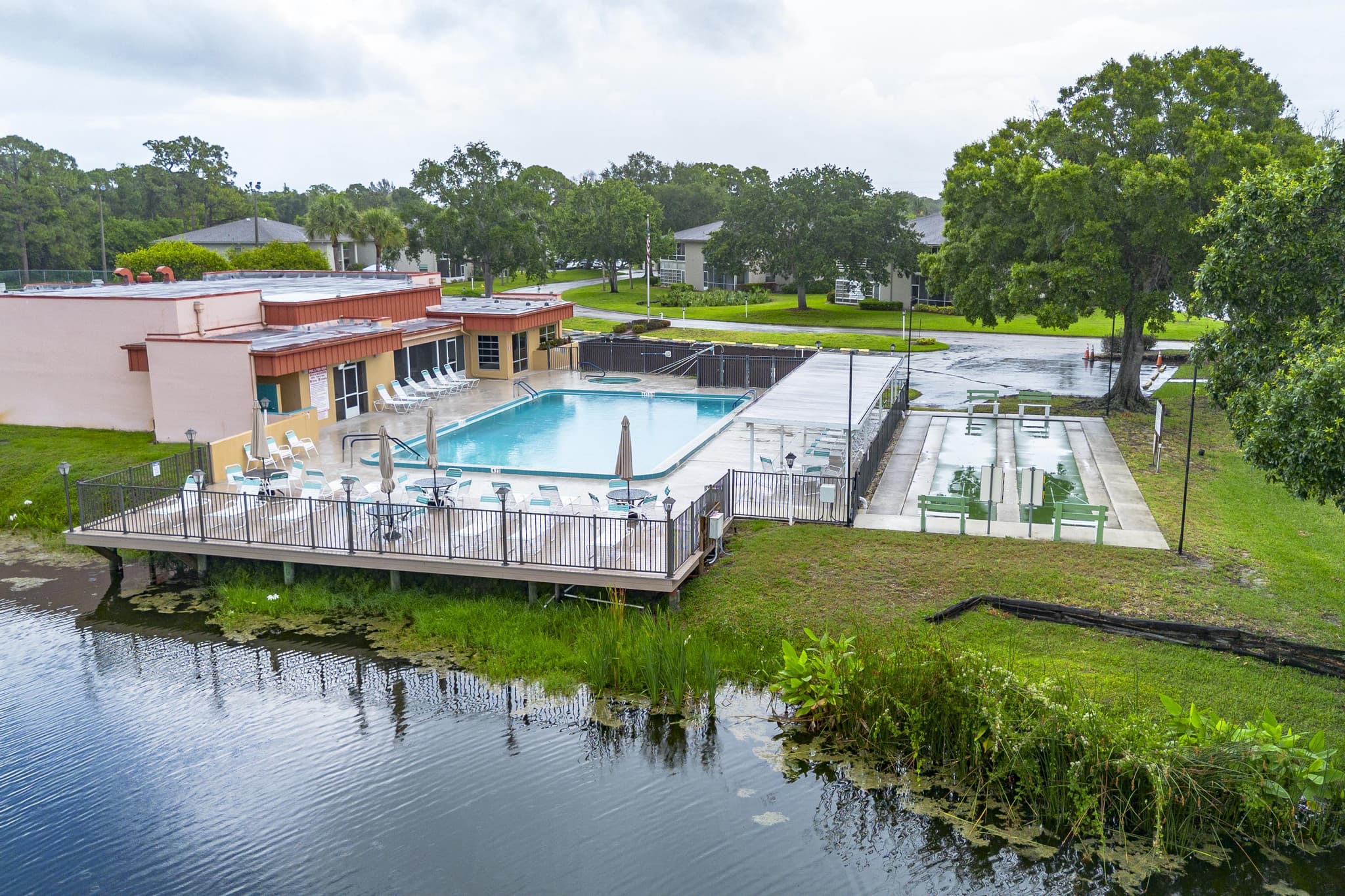 Drone aerial of the waterfront community pool near 3 Lake Vista Trail