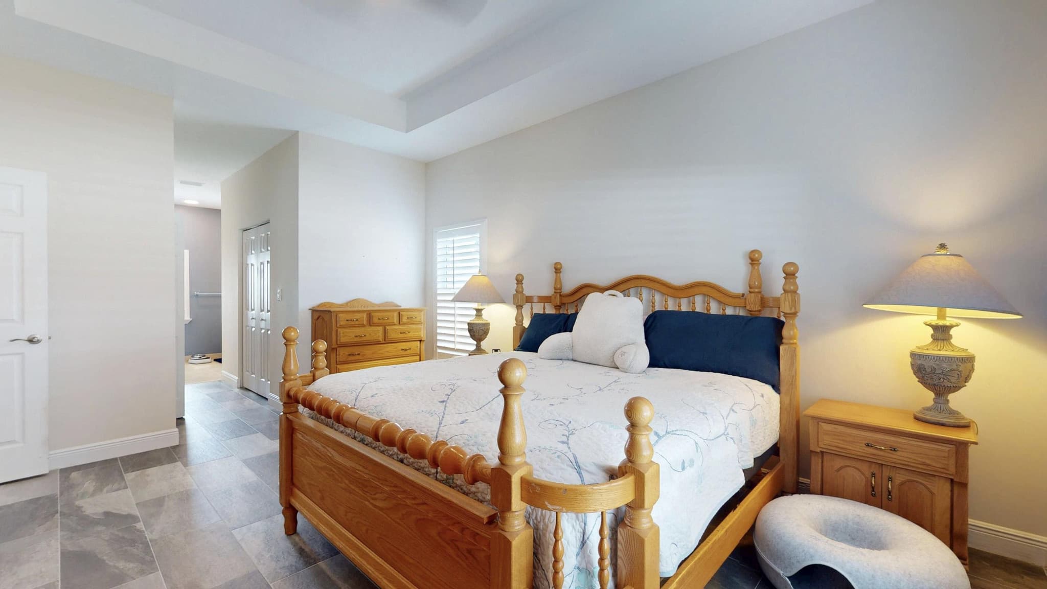Primary bedroom with wood furniture