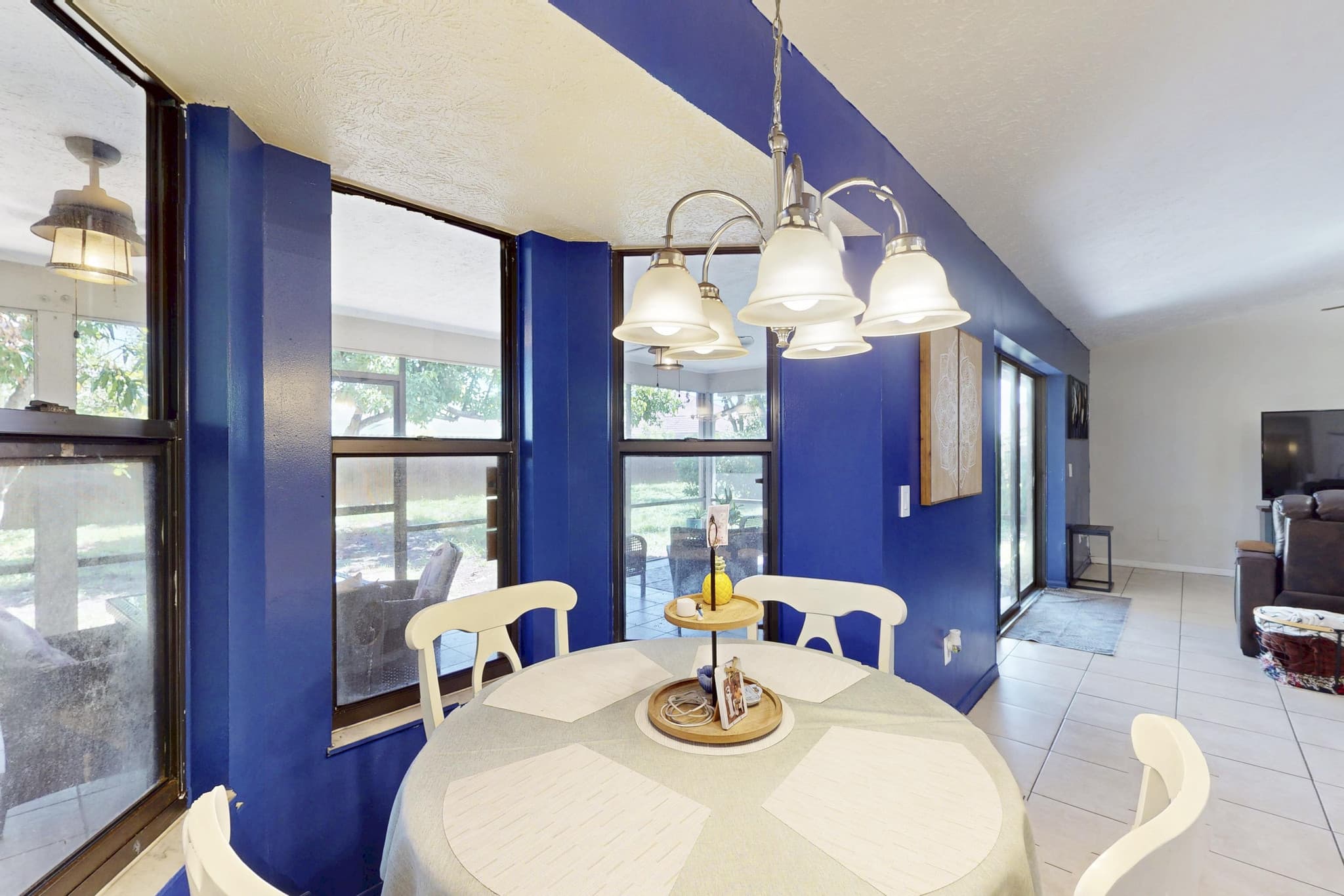 Blue dining room with chandelier