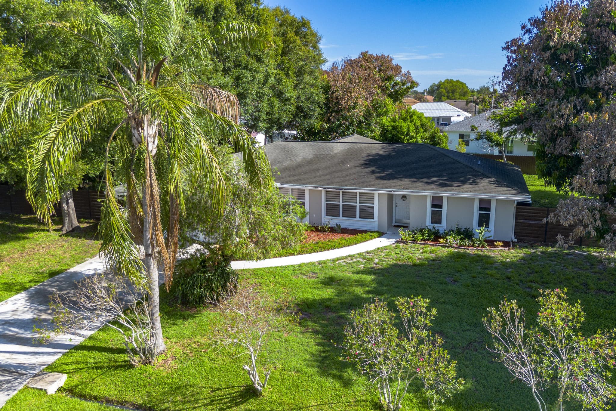 Drone aerial of 749 SW McCracken Ave and its wooded lot