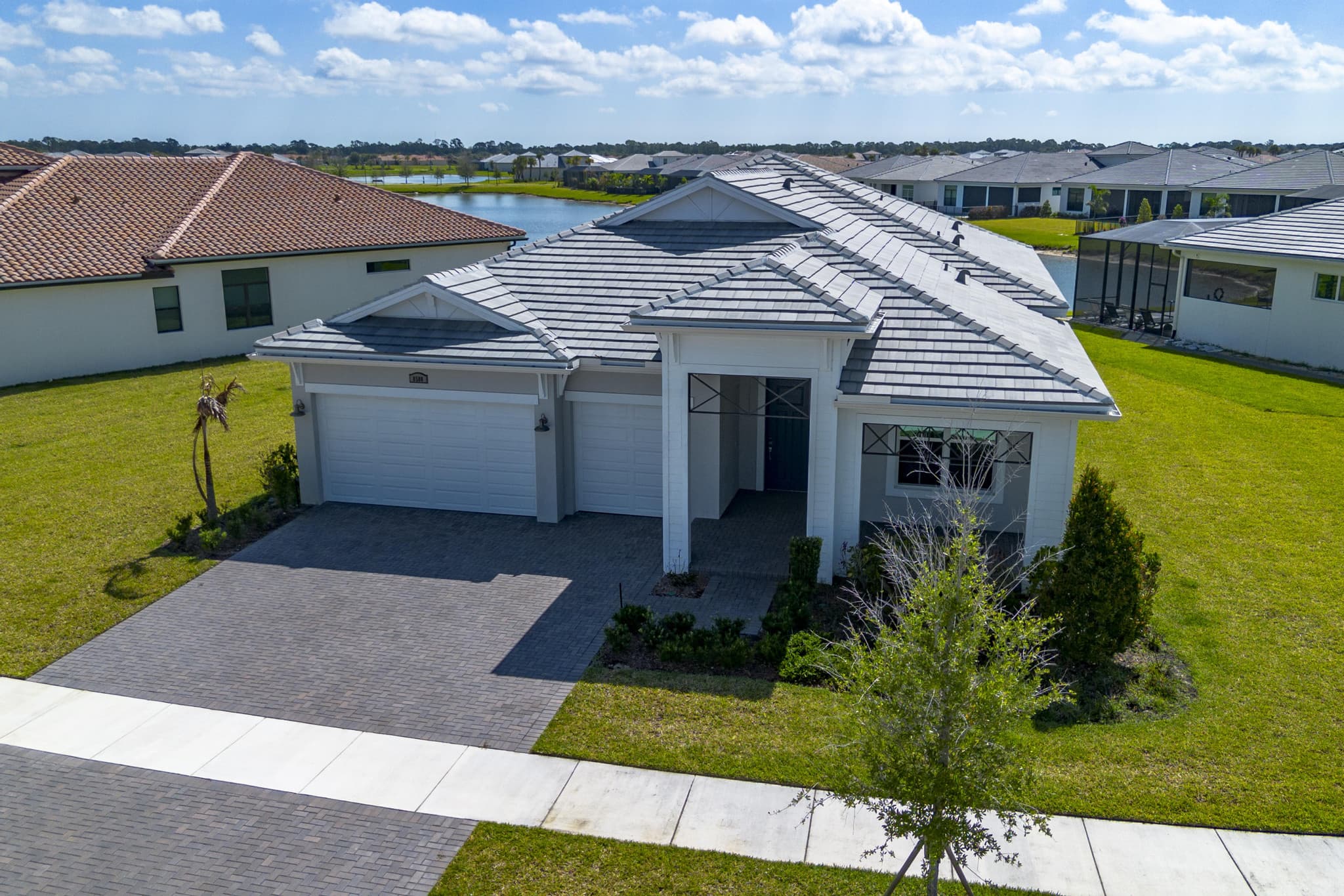 Aerial of the home in its new-construction street