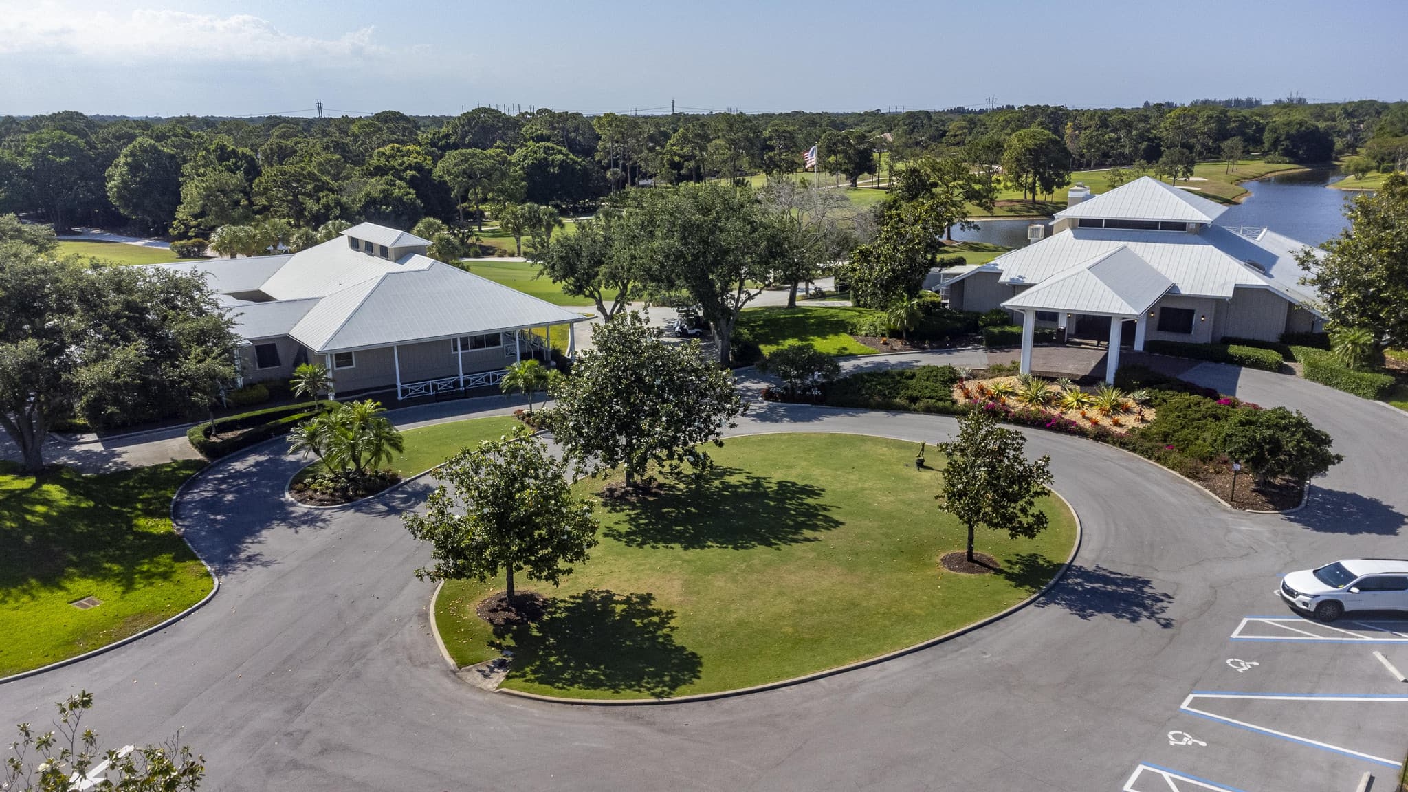 Drone aerial showing the home, lot, and surrounding neighborhood