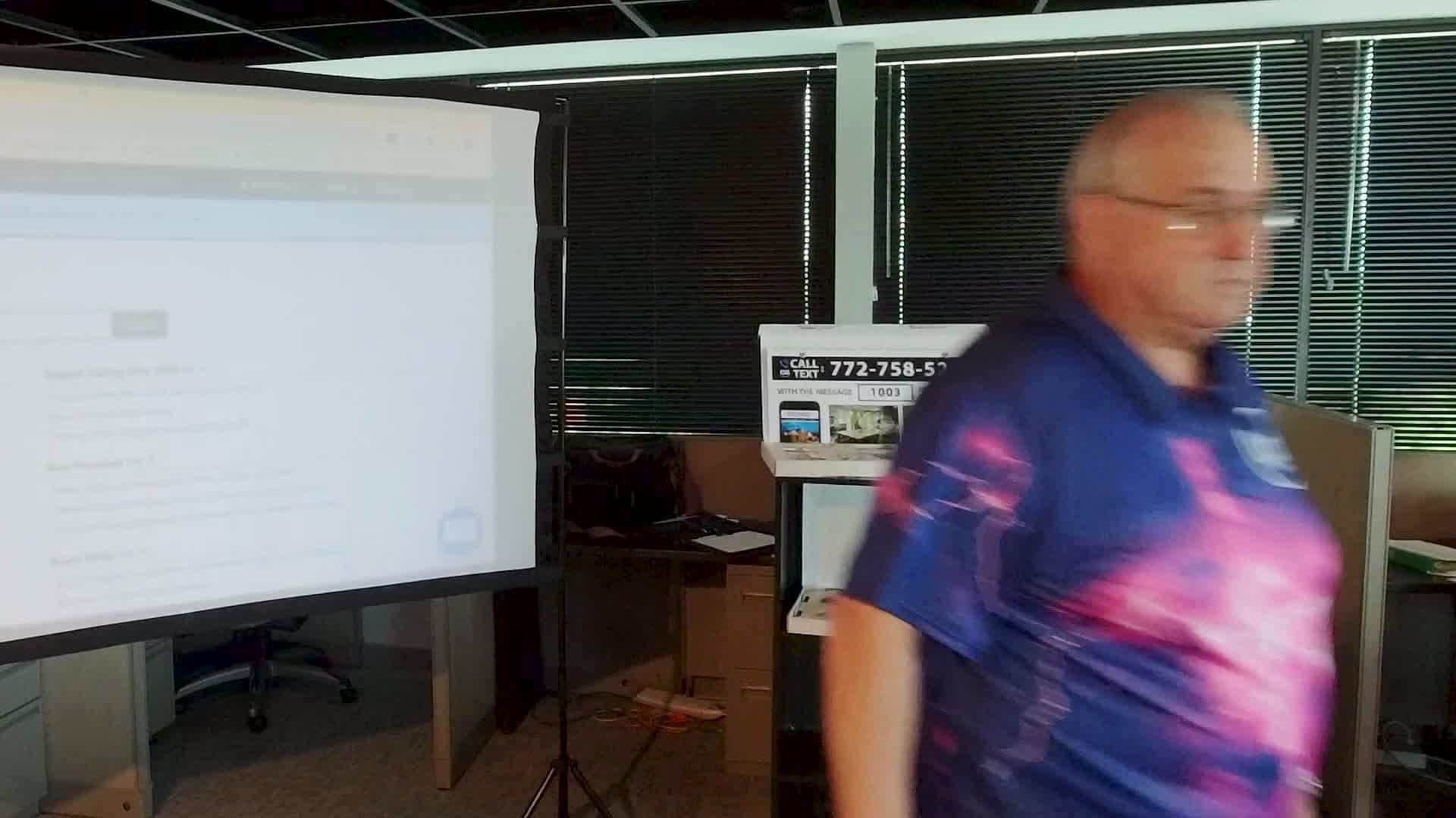 Lit stage and screen at a team workshop covered by ipixx